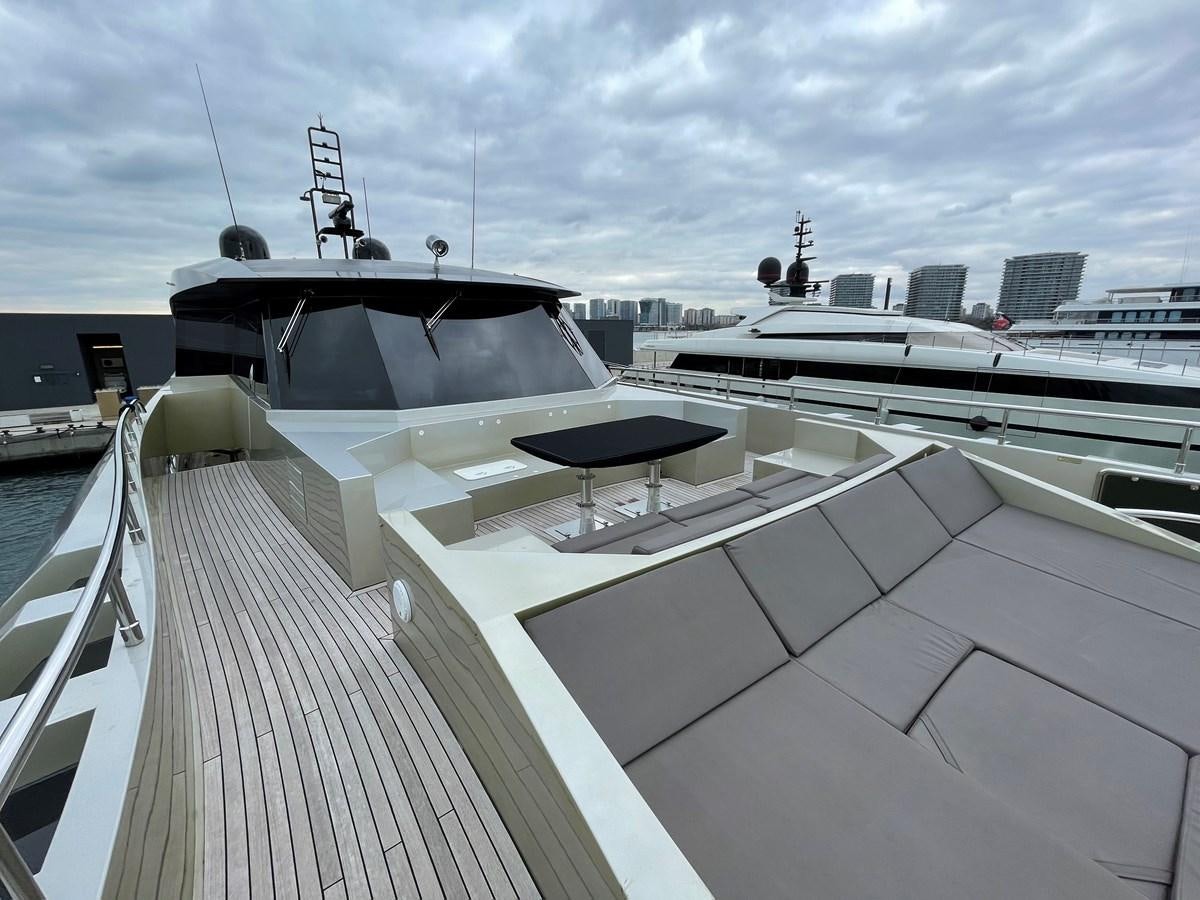 a deck with a large boat on it aboard AQUILA Yacht for Sale