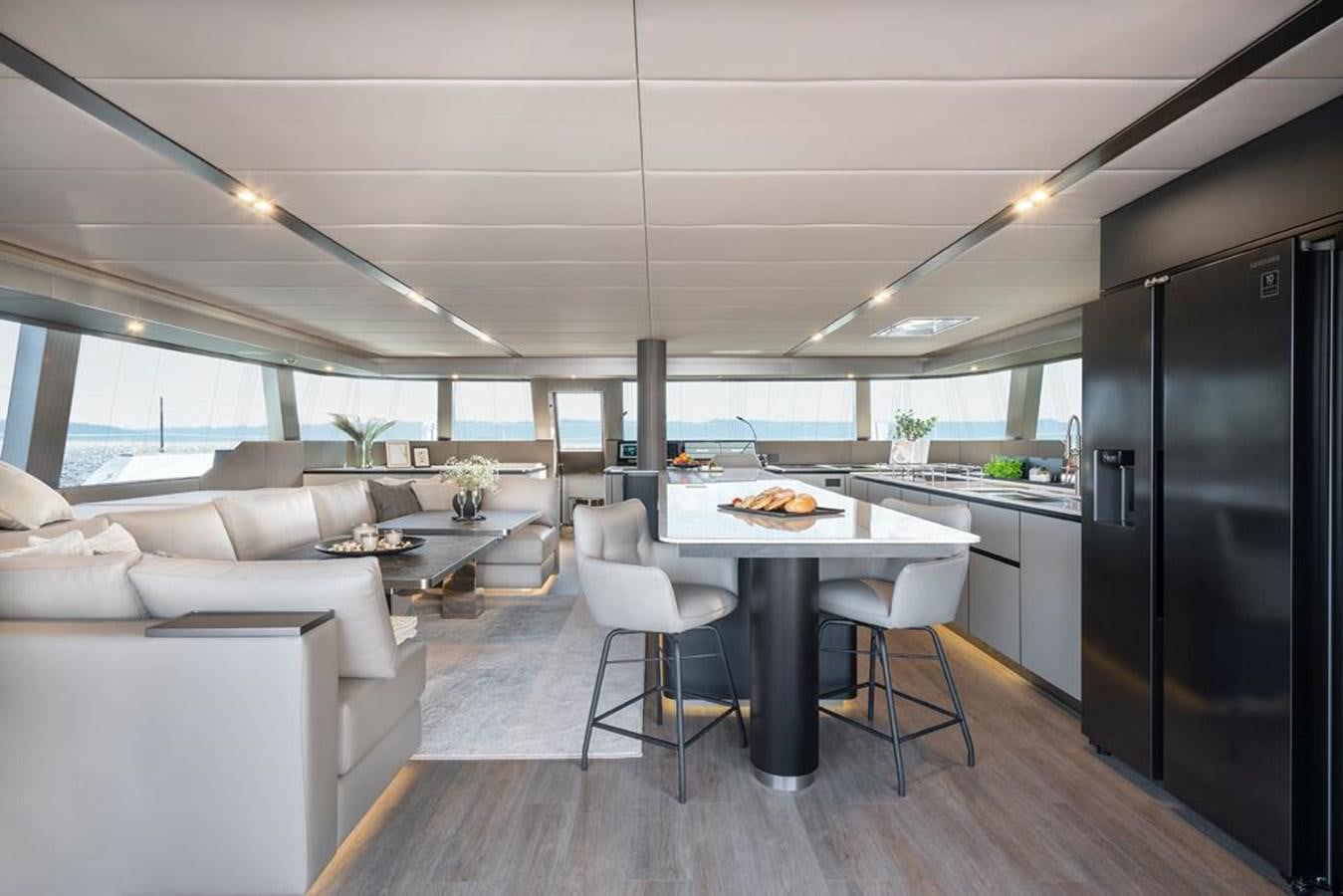 a kitchen and living room aboard STYLIA Yacht for Sale