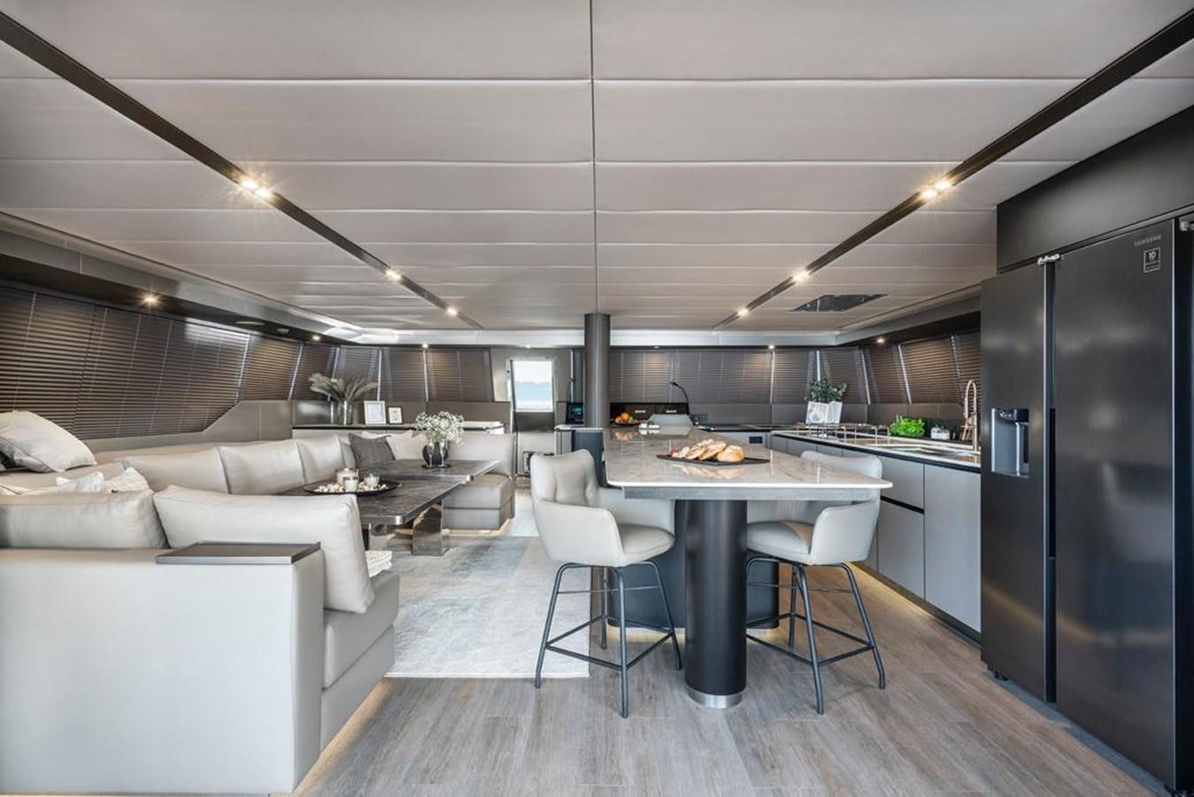 a kitchen and living room aboard STYLIA Yacht for Sale