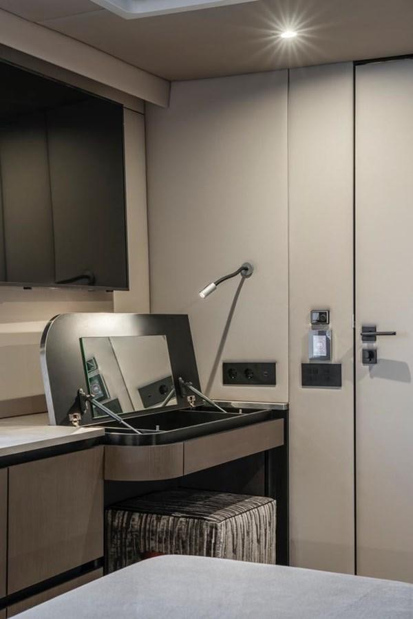 a kitchen with a sink and a lamp aboard STYLIA Yacht for Sale