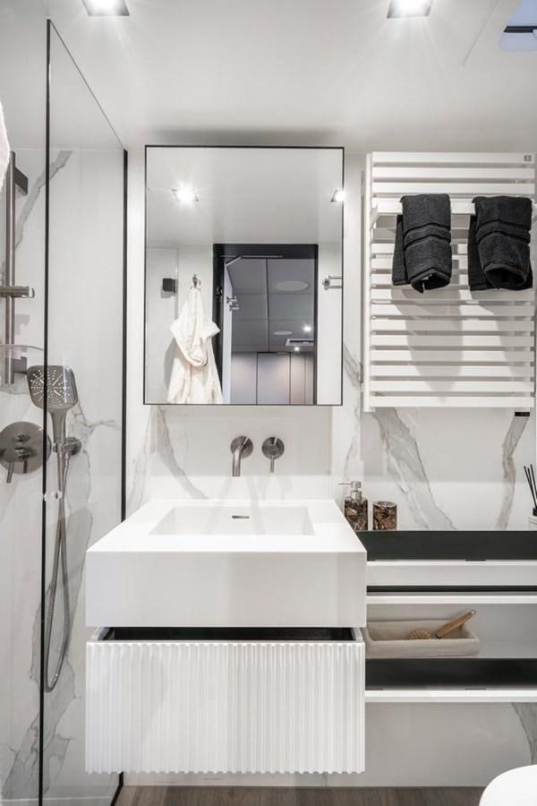 a bathroom with a large mirror aboard STYLIA Yacht for Sale