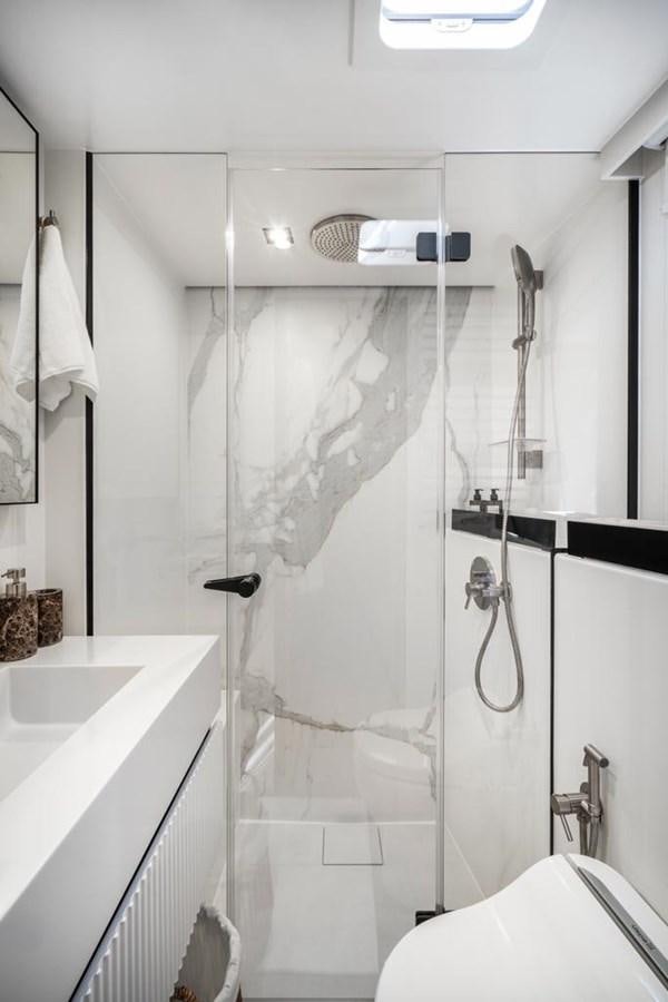 a shower with a shower curtain aboard STYLIA Yacht for Sale