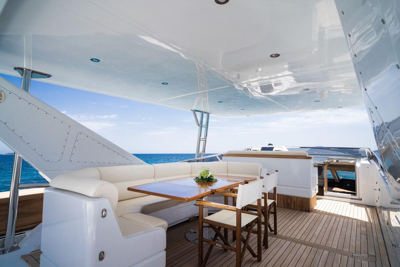 a boat with a table and chairs aboard ALEDOUTHO Yacht for Sale