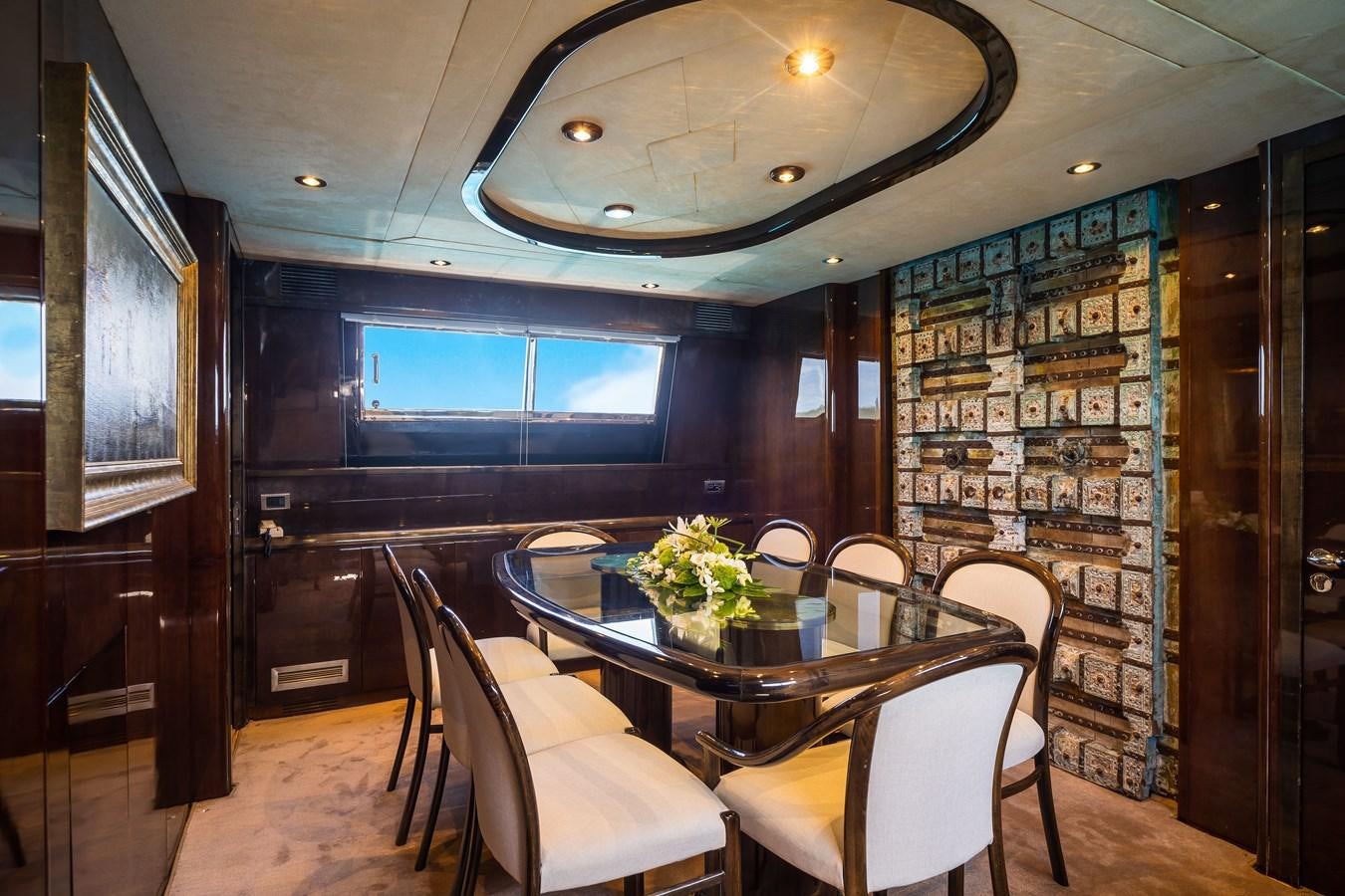 a room with a table and chairs aboard ALEDOUTHO Yacht for Sale