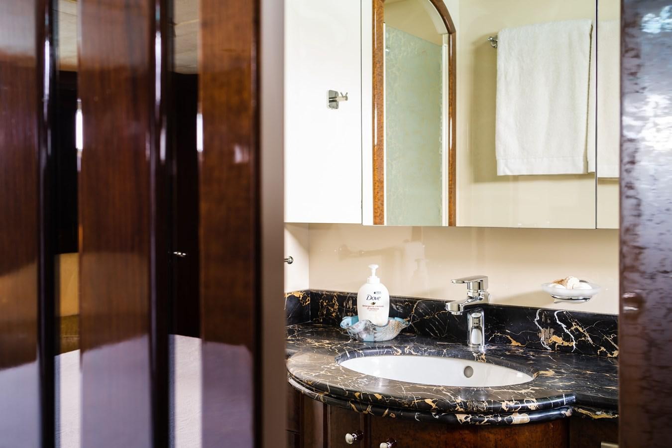 a bathroom with a sink and a mirror aboard ALEDOUTHO Yacht for Sale