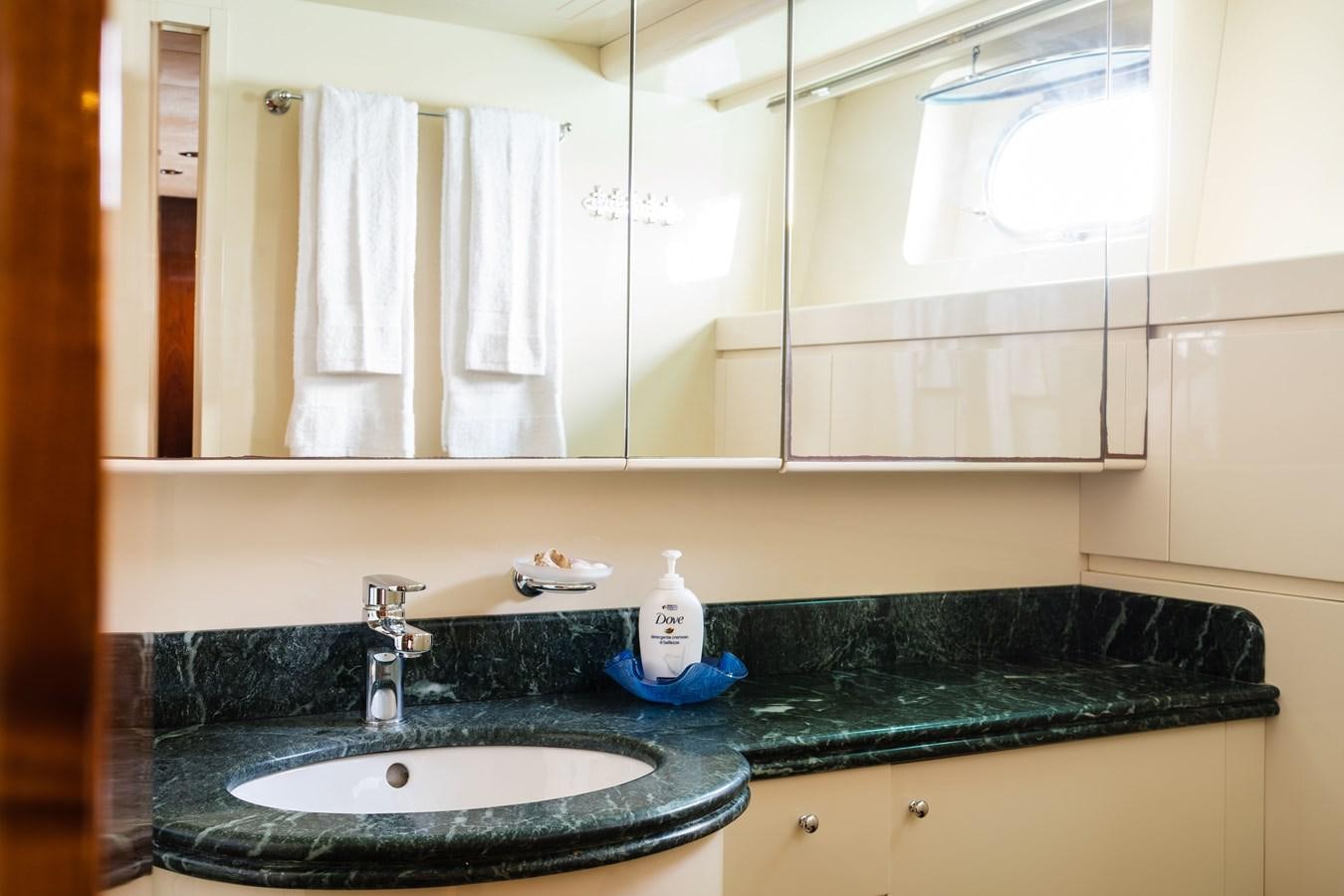 a bathroom with a sink and a mirror aboard ALEDOUTHO Yacht for Sale