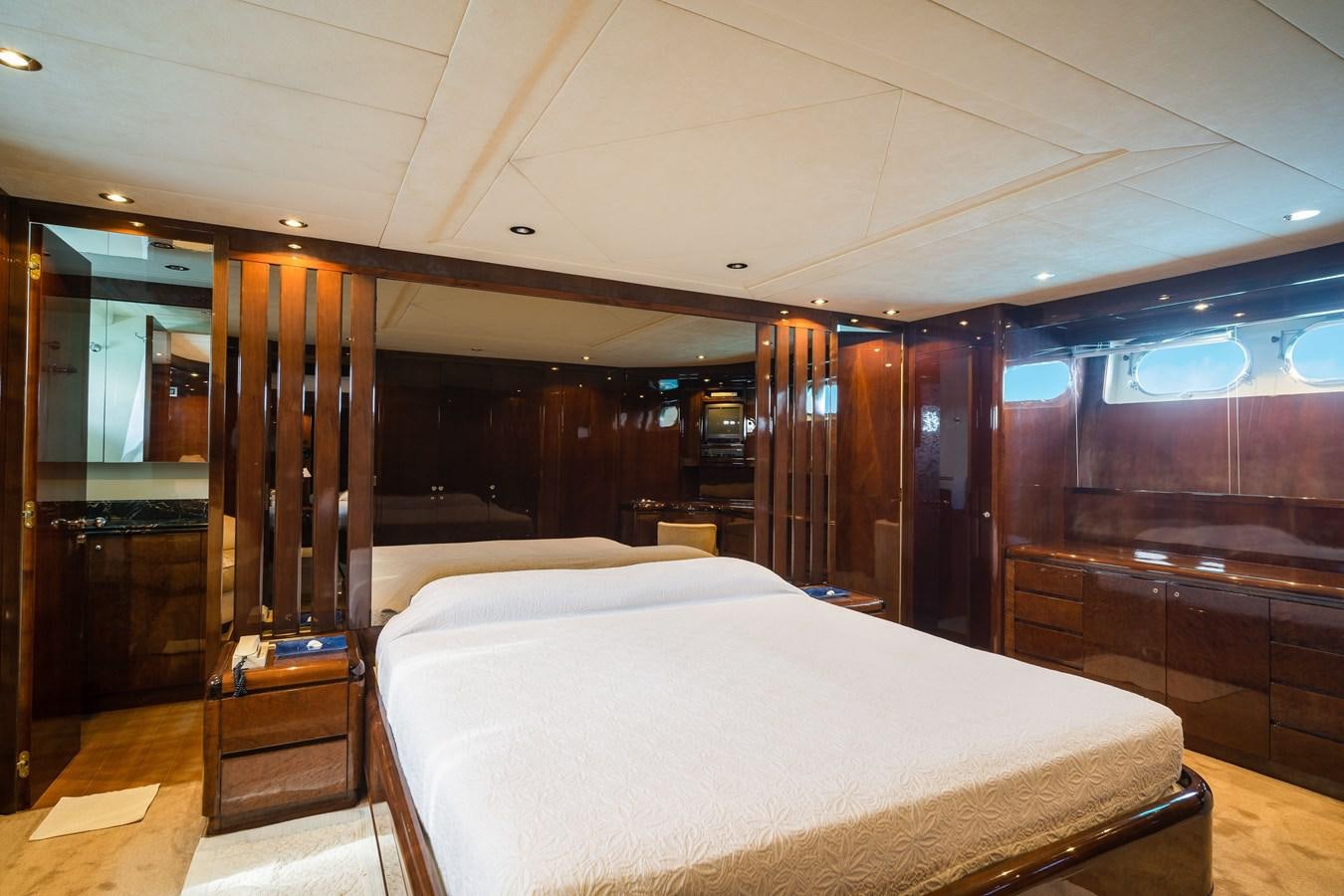 a room with a bed and a mirror aboard ALEDOUTHO Yacht for Sale