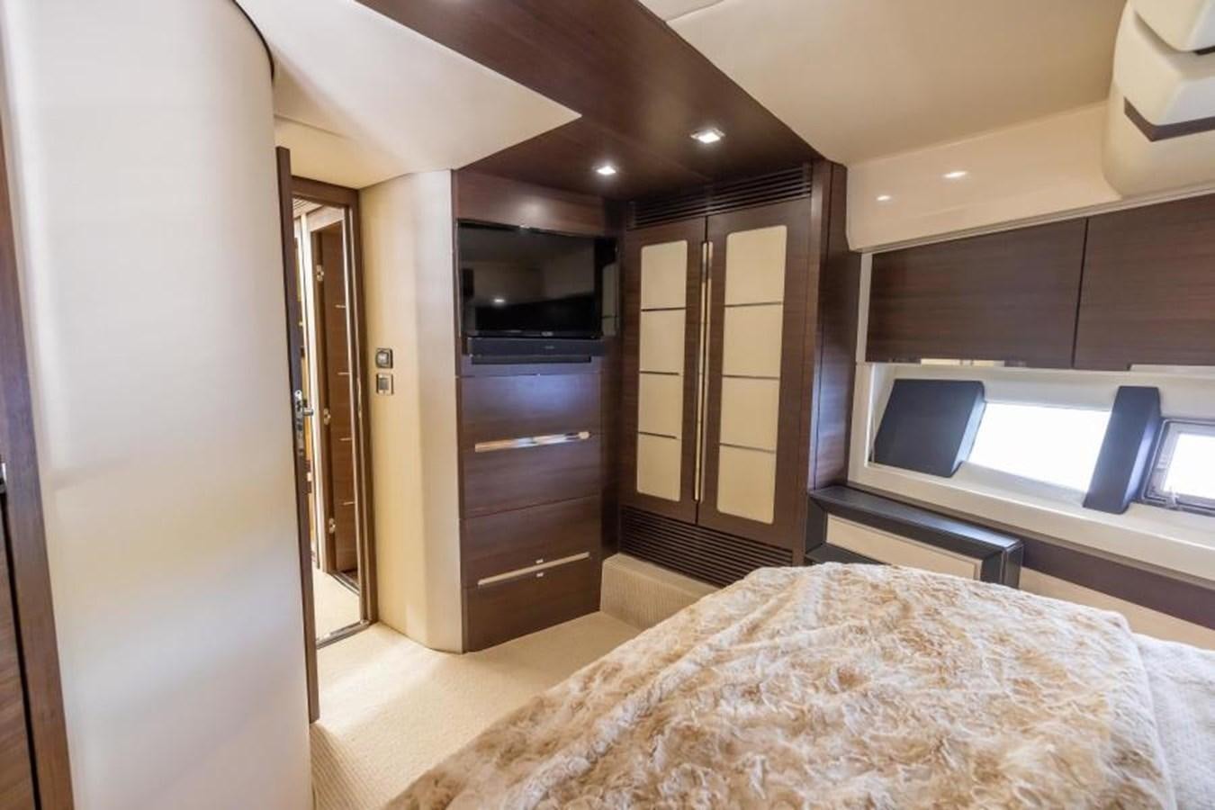 a bedroom with a bed and a desk aboard MEANT TO BE Yacht for Sale