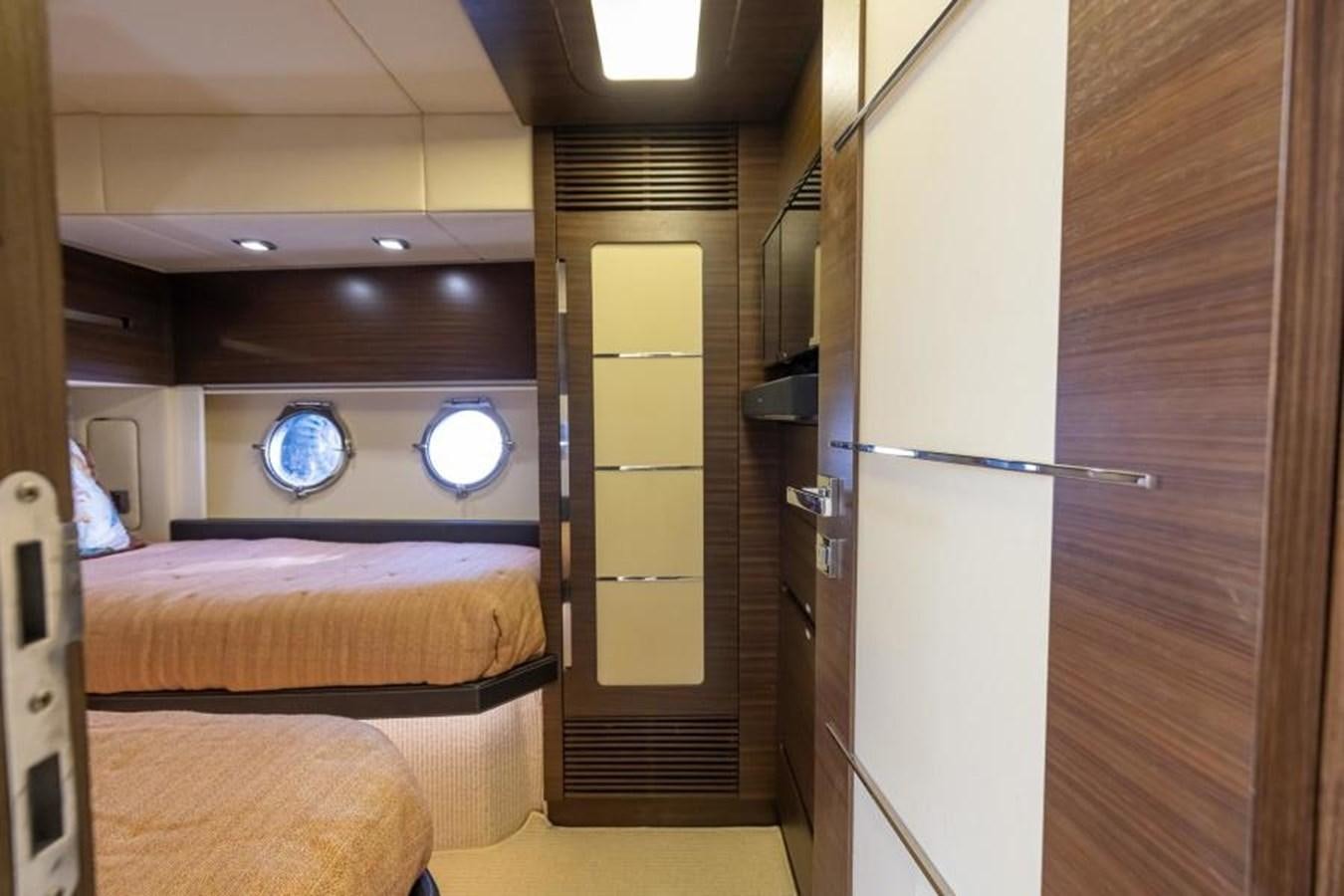 a room with a bed and a door aboard MEANT TO BE Yacht for Sale