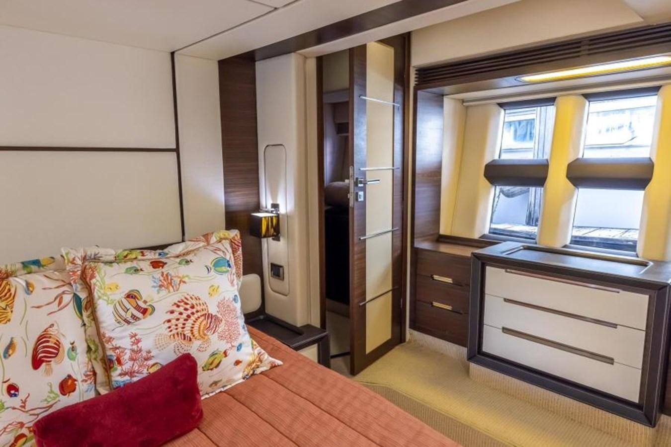 a bedroom with a bed and a desk aboard MEANT TO BE Yacht for Sale