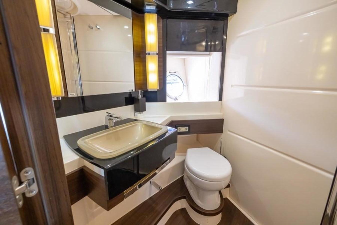 a bathroom with a sink and a toilet aboard MEANT TO BE Yacht for Sale