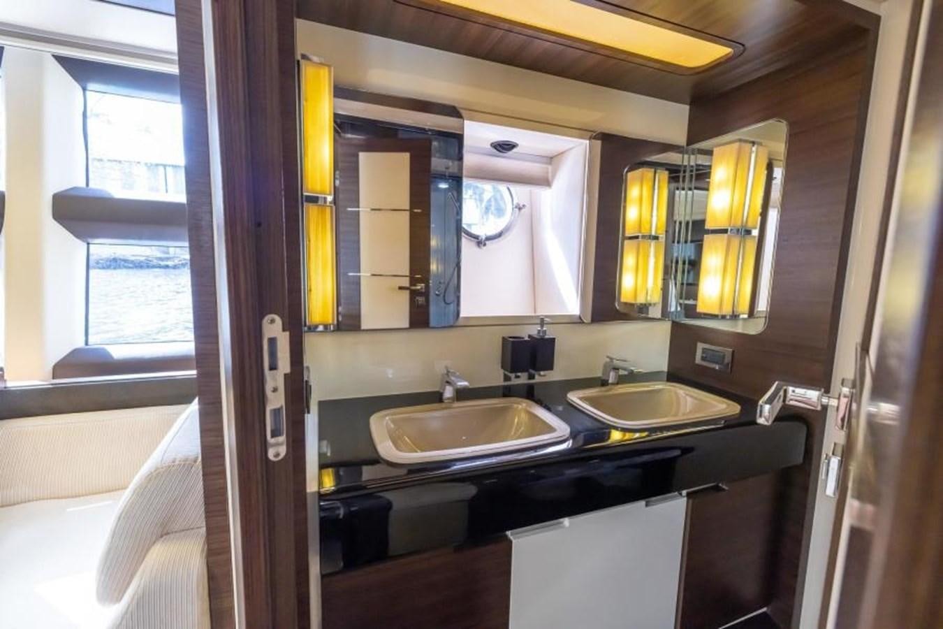 a bathroom with sinks and mirrors aboard MEANT TO BE Yacht for Sale