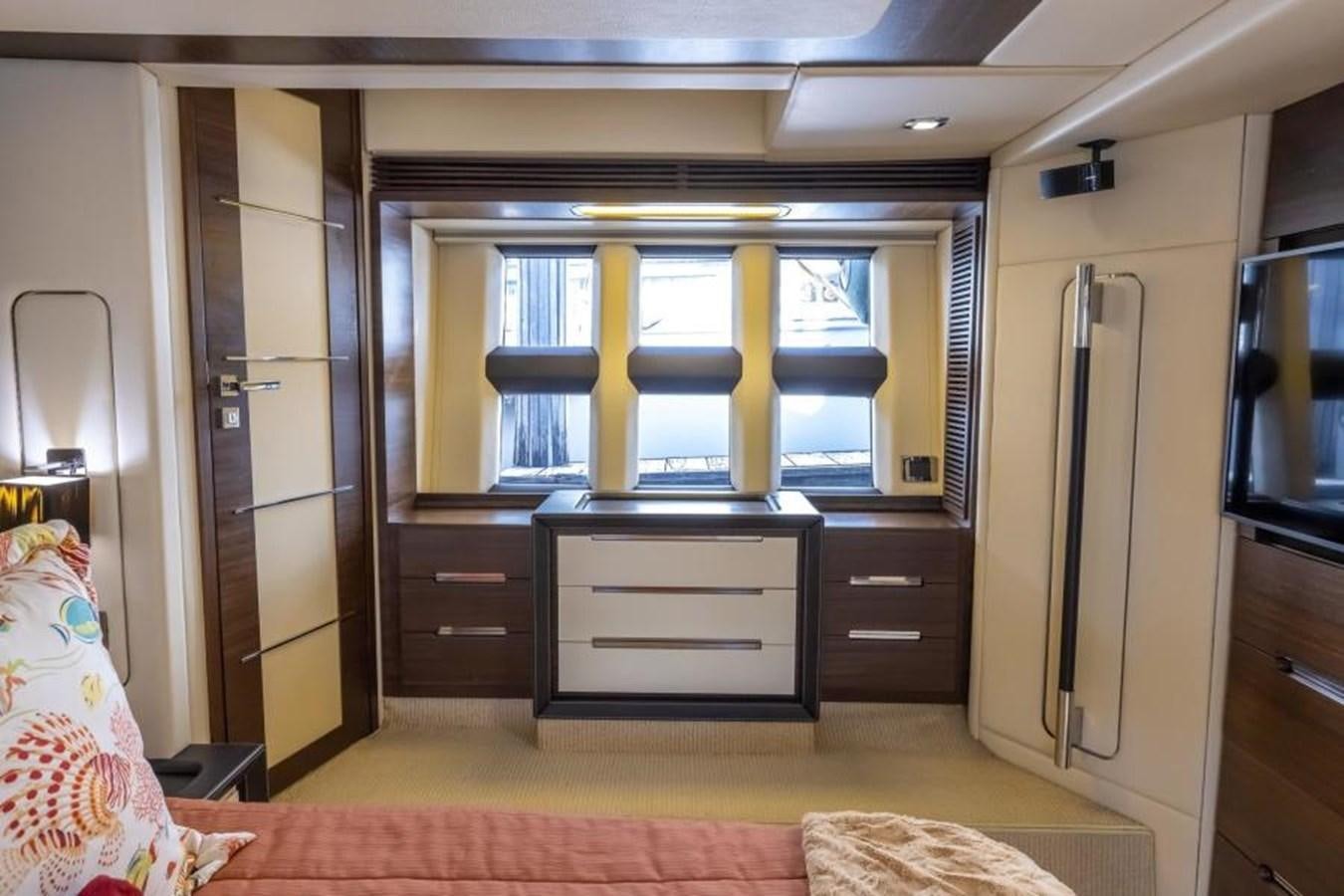 a room with a closet and a bed aboard MEANT TO BE Yacht for Sale