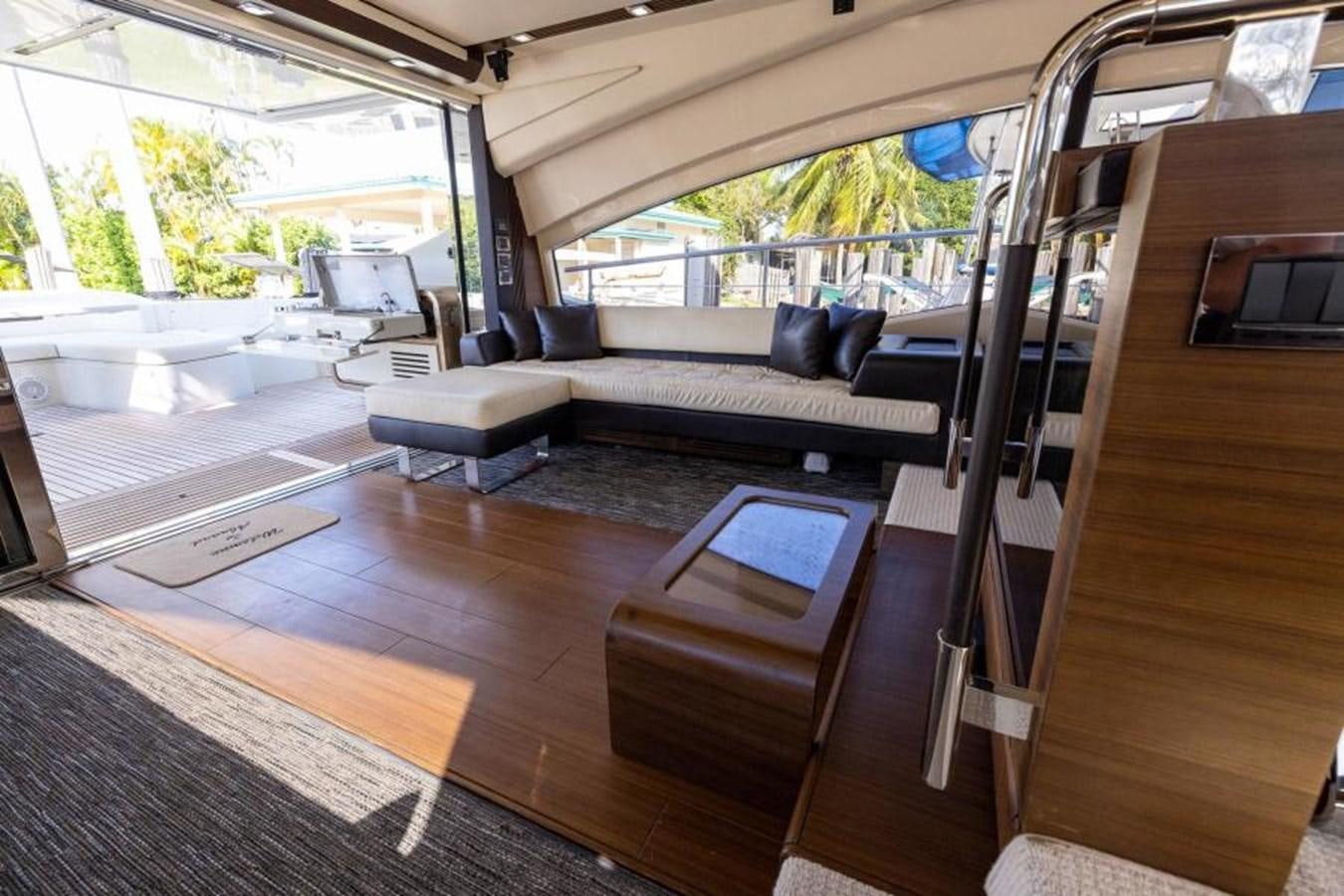 a room with a couch and a table aboard MEANT TO BE Yacht for Sale