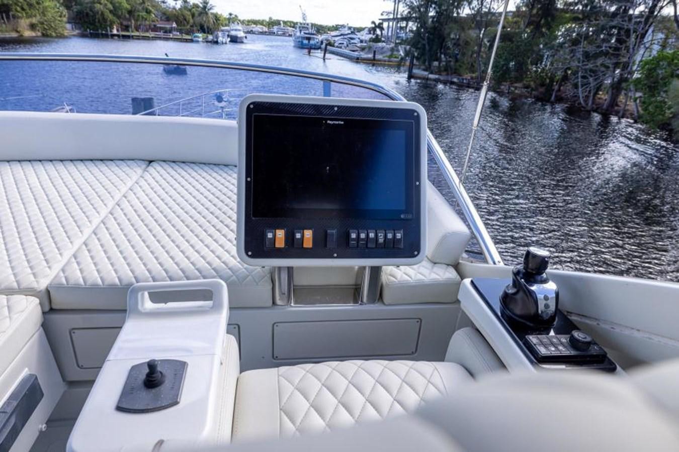 a boat with a screen on the front aboard MEANT TO BE Yacht for Sale