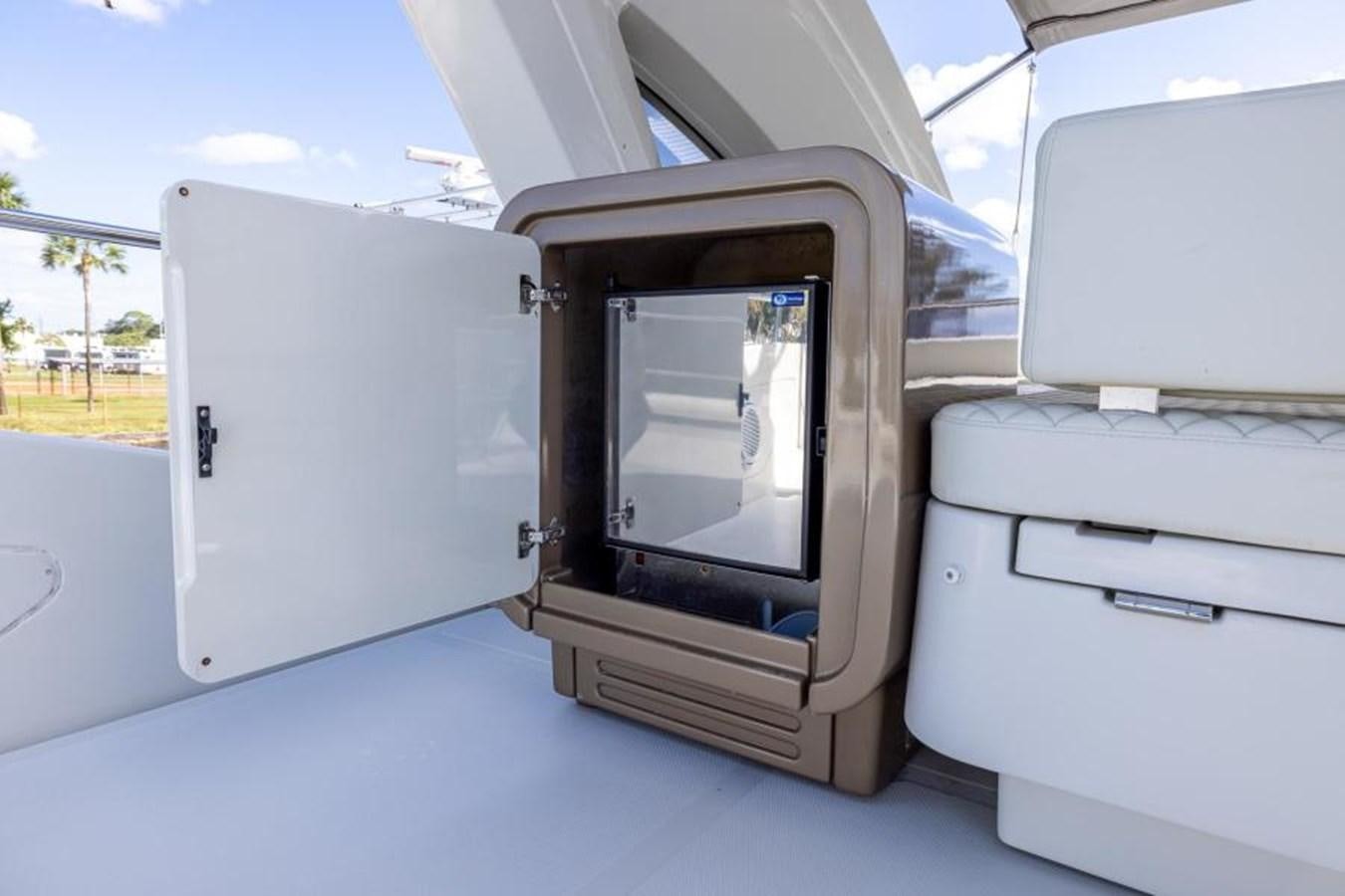 a white car with a door open aboard MEANT TO BE Yacht for Sale