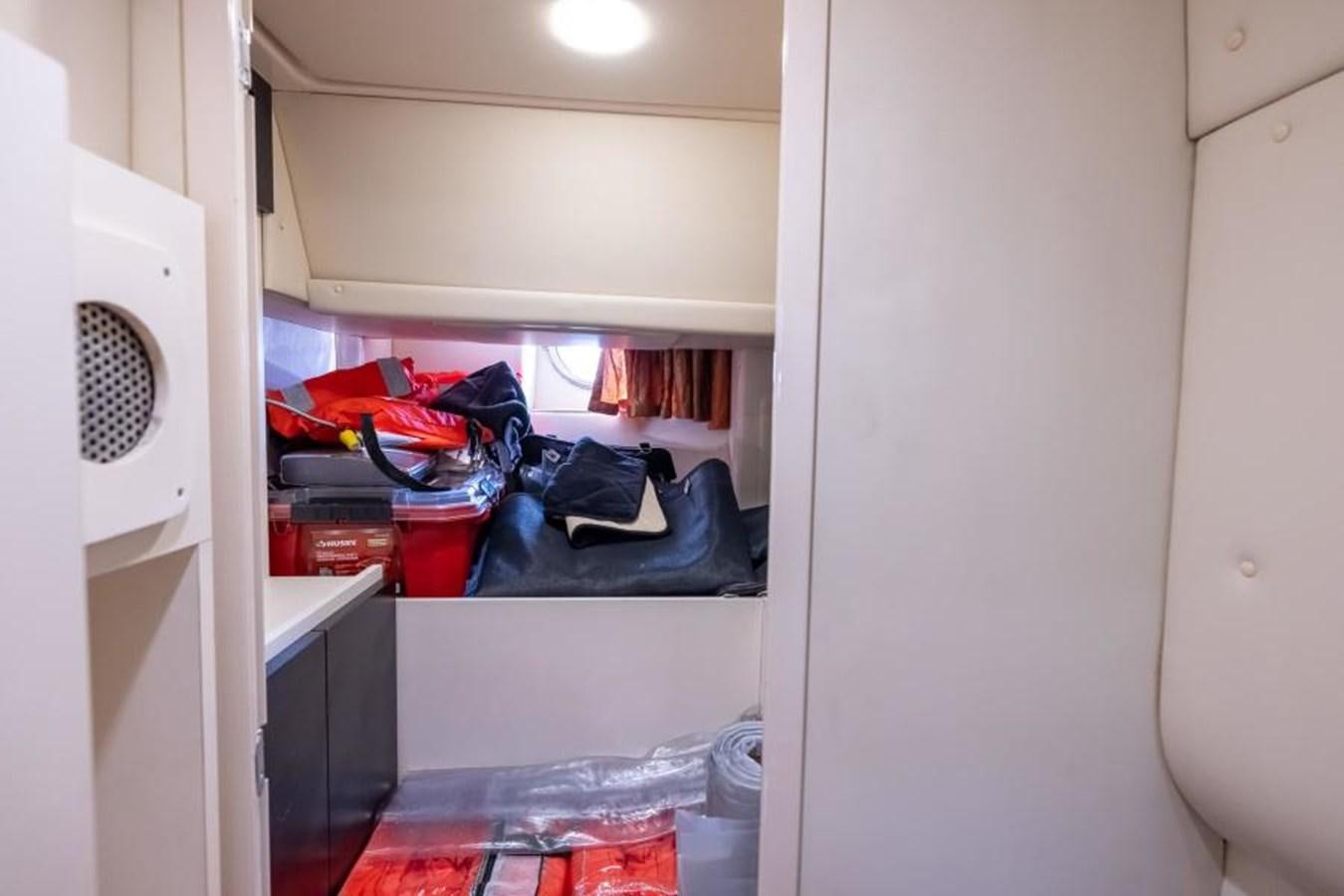 a closet with clothes and clothes aboard MEANT TO BE Yacht for Sale