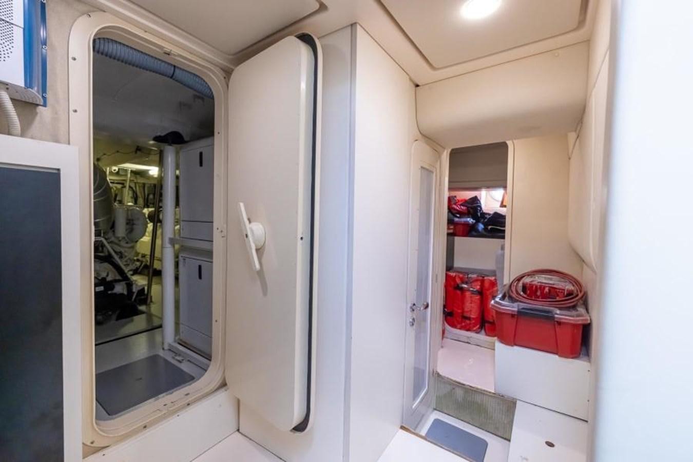 a room with a mirror and a closet aboard MEANT TO BE Yacht for Sale