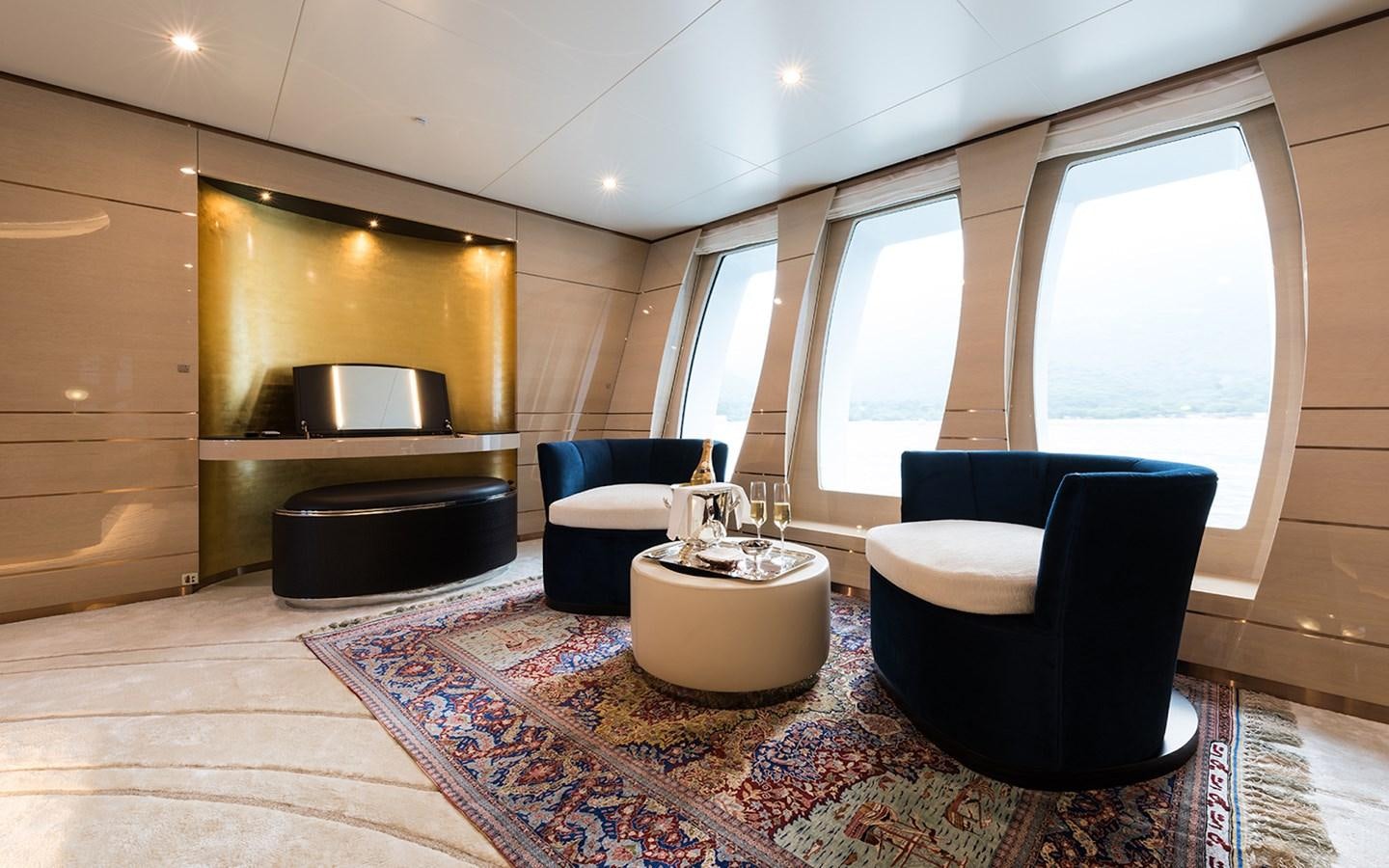 a modern looking living room aboard ALMAX Yacht for Sale