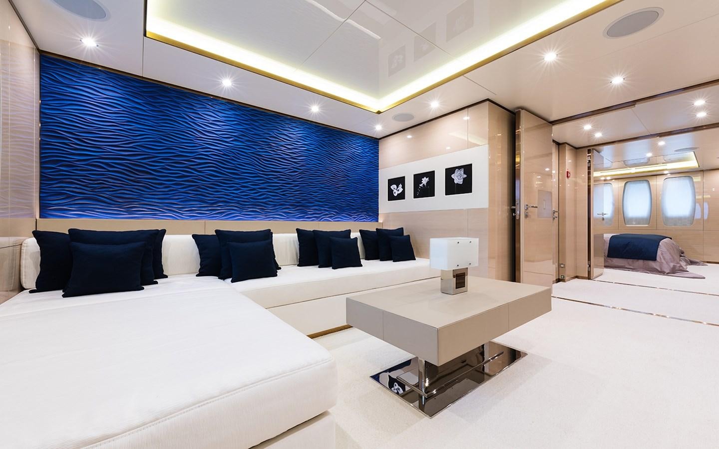 a room with a bed and a table aboard ALMAX Yacht for Sale