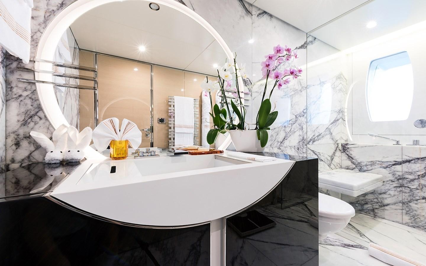 a bathroom with a sink and a mirror aboard ALMAX Yacht for Sale