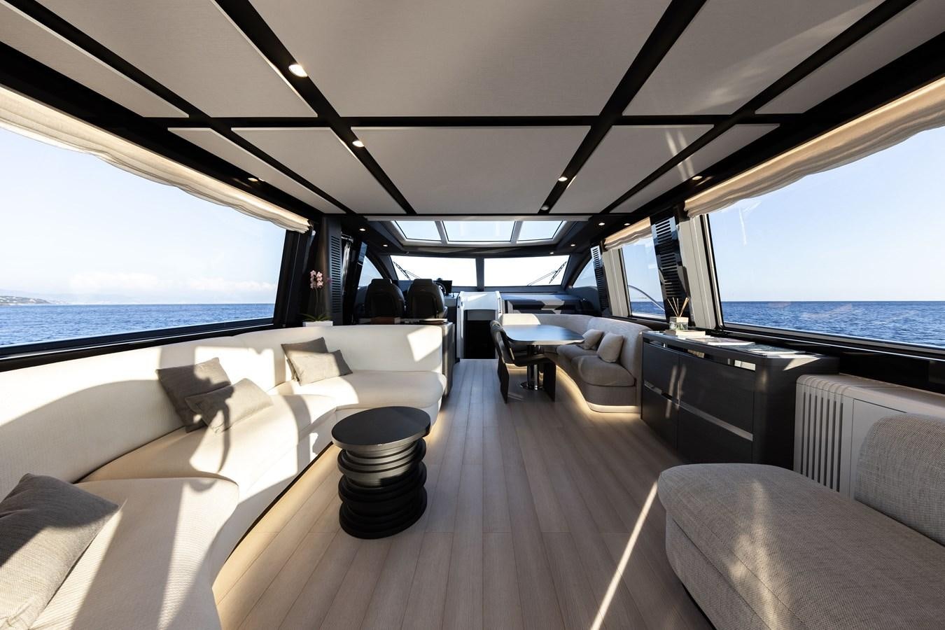 a boat with seats and a body of water in the background aboard NEVER GIVE UP Yacht for Sale