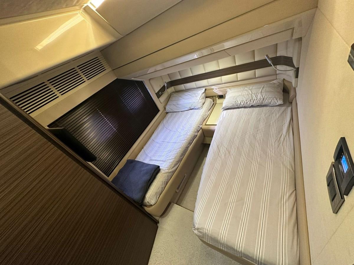 a bunk bed with a couple of beds in it aboard AZIMUT 64 FLY 2014 Yacht for Sale