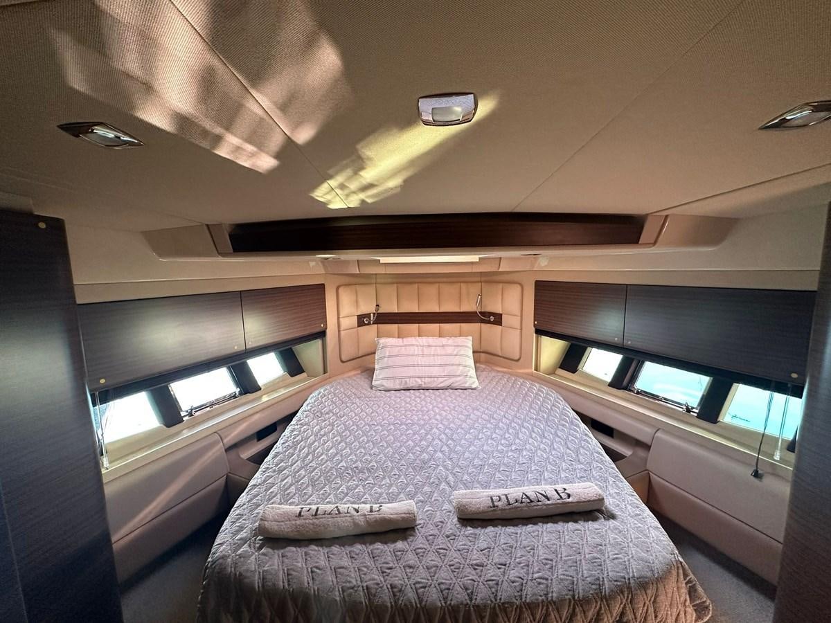a bed in a room aboard AZIMUT 64 FLY 2014 Yacht for Sale