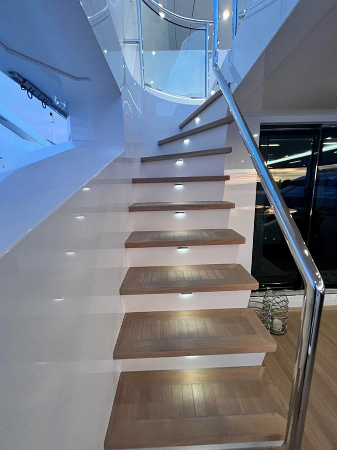 a set of stairs in a building aboard ROMEO FOXTROT Yacht for Sale
