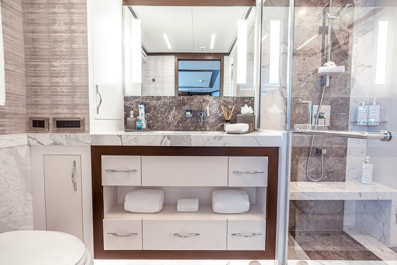 a sink and a mirror in a bathroom aboard ROMEO FOXTROT Yacht for Sale