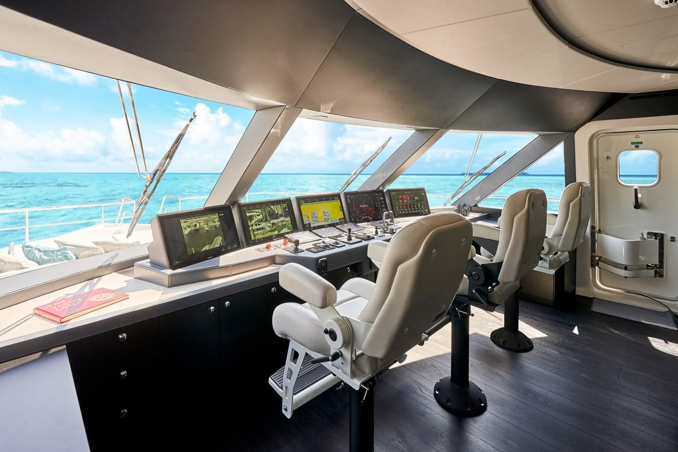 a room with many computers and monitors aboard ROMEO FOXTROT Yacht for Sale
