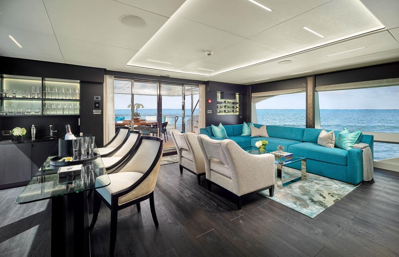 a living room with a large window aboard ROMEO FOXTROT Yacht for Sale