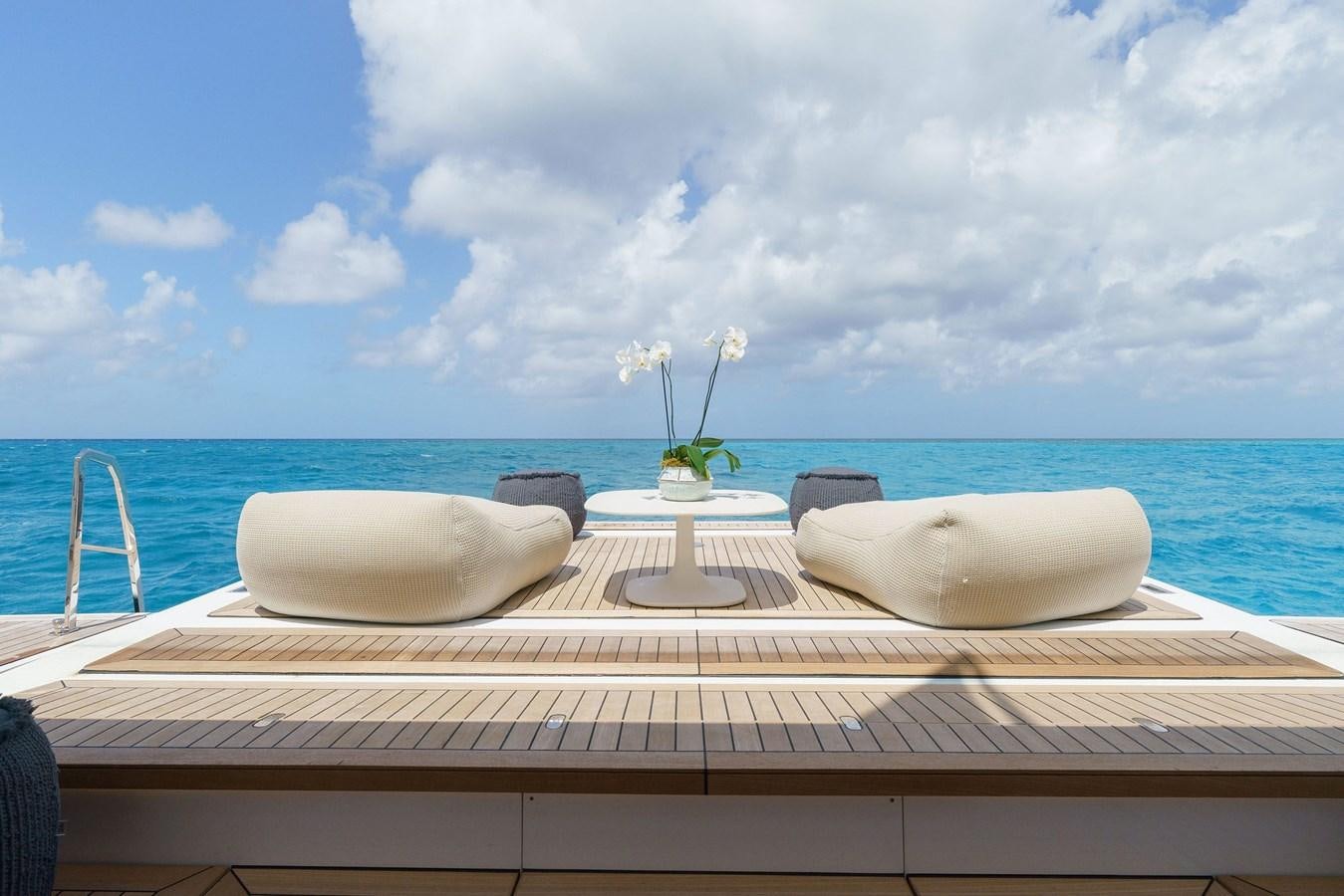 a table with a vase and a flower on it aboard ASANTE Yacht for Sale
