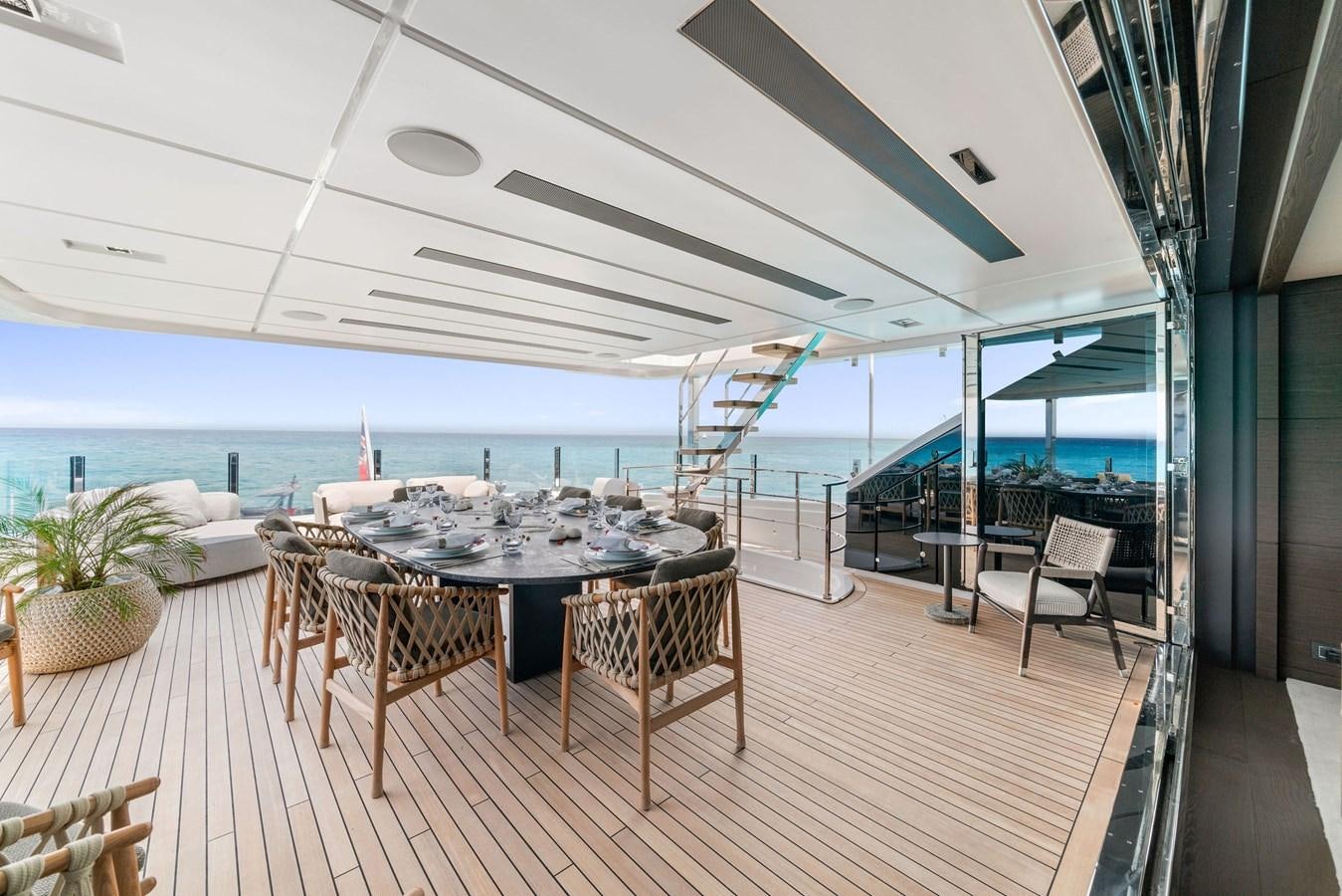 a room with a table and chairs aboard ASANTE Yacht for Sale