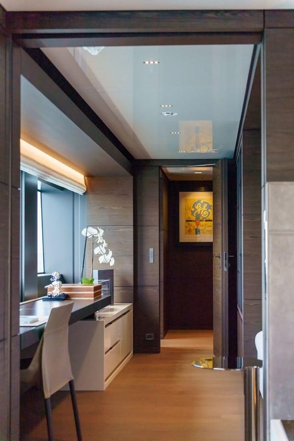 a room with a desk and a door aboard ASANTE Yacht for Sale