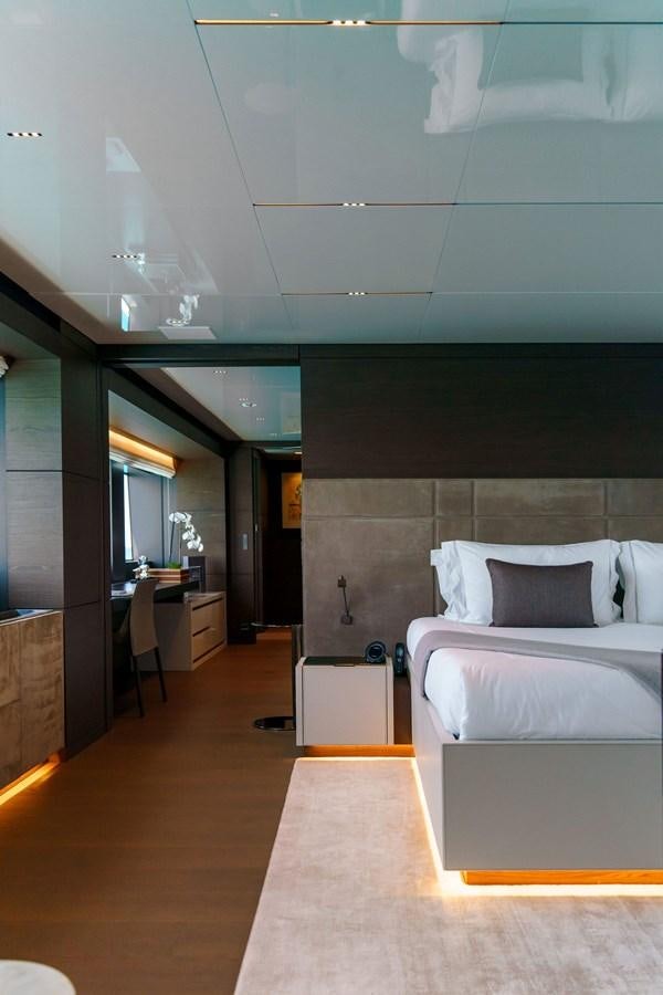 a room with a bed and a desk aboard ASANTE Yacht for Sale