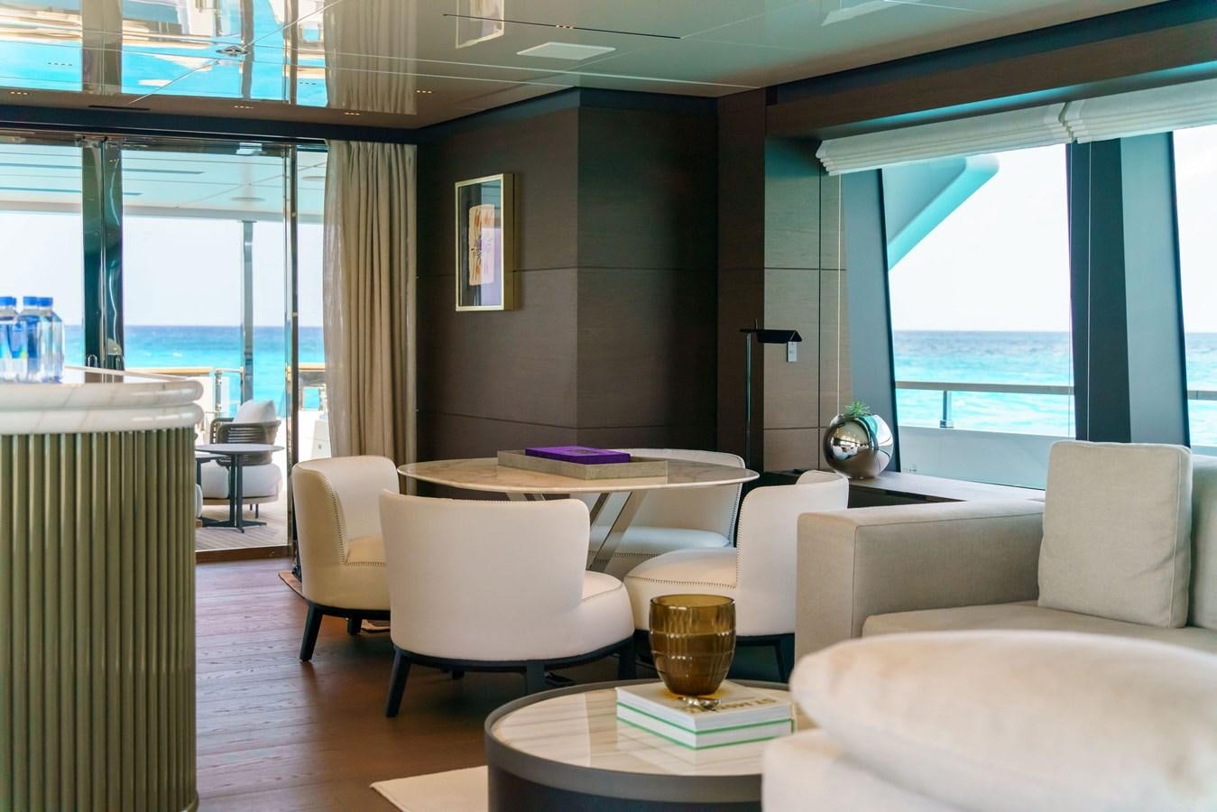 a room with a table chairs and a window aboard ASANTE Yacht for Sale