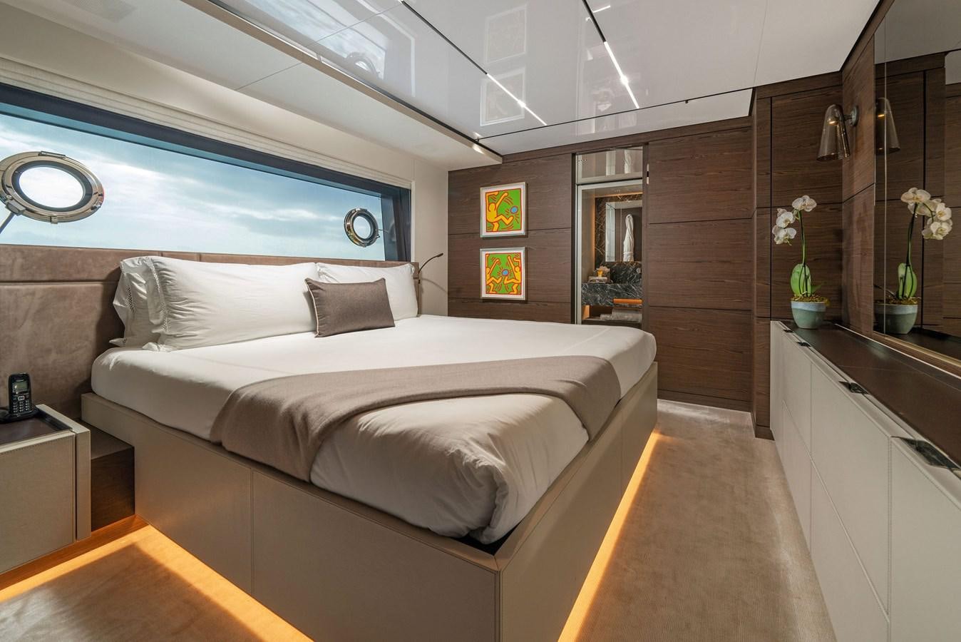 a bed in a room aboard ASANTE Yacht for Sale