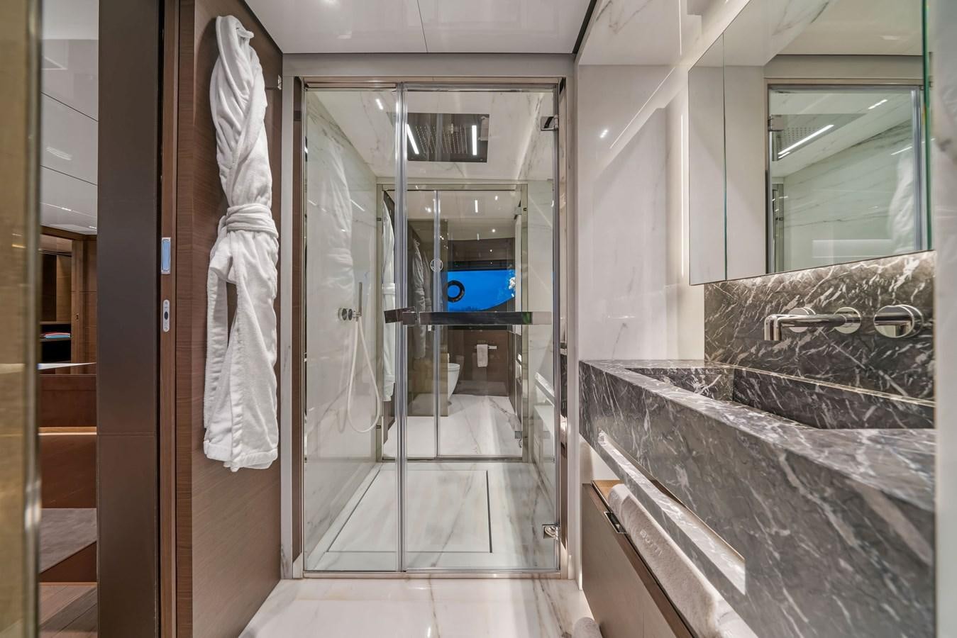 a bathroom with a glass shower aboard ASANTE Yacht for Sale