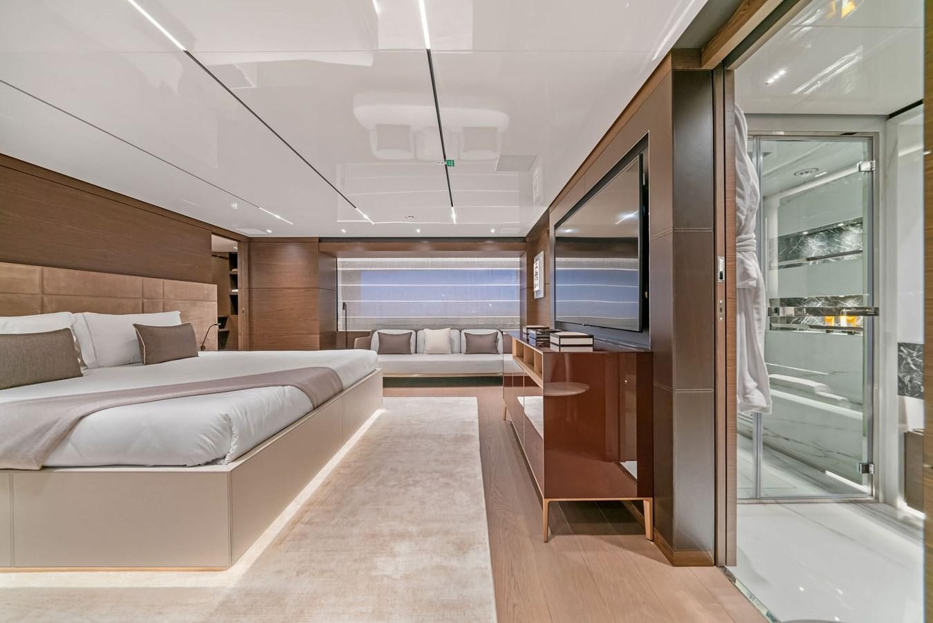 a room with a bed and a mirror aboard ASANTE Yacht for Sale