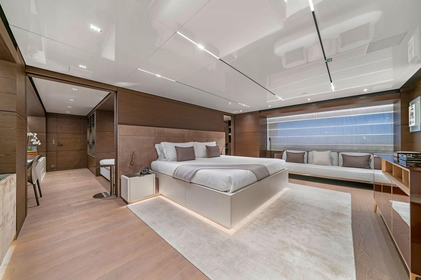 a large room with a bed and a large window aboard ASANTE Yacht for Sale