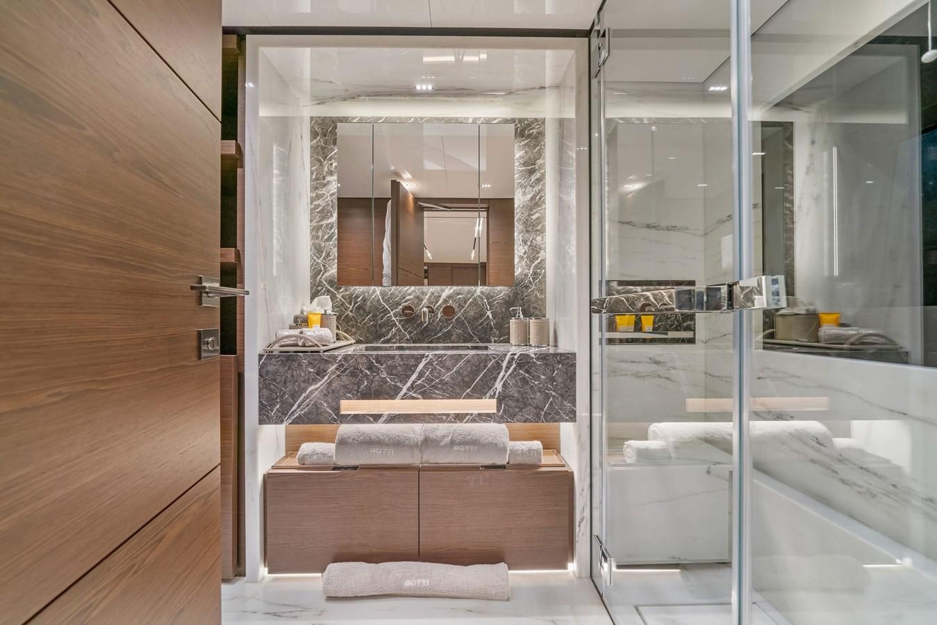 a bathroom with a glass shower aboard ASANTE Yacht for Sale