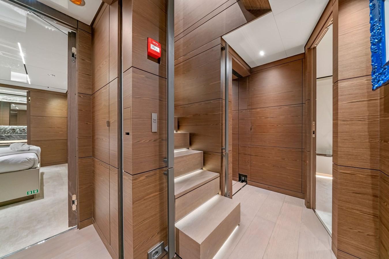 a room with wooden walls and a staircase aboard ASANTE Yacht for Sale