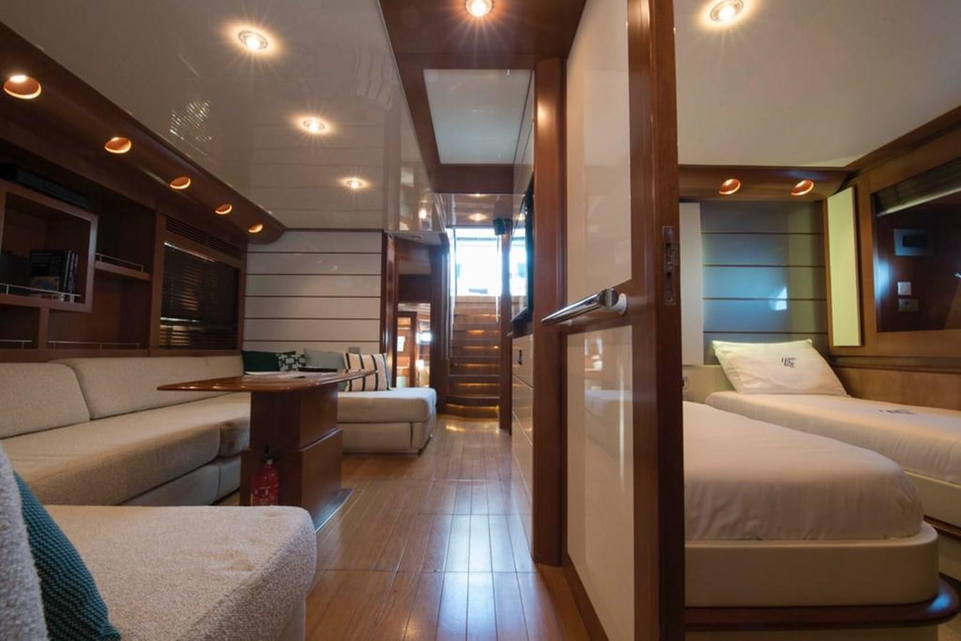 a room with a bed and a table aboard 4F Yacht for Sale