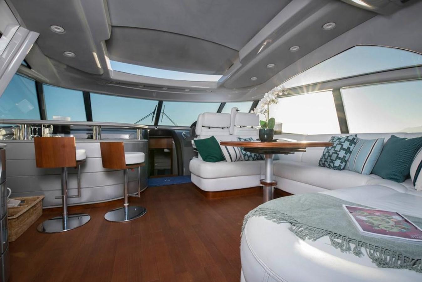 a room with a couch and a table and a chair aboard 4F Yacht for Sale