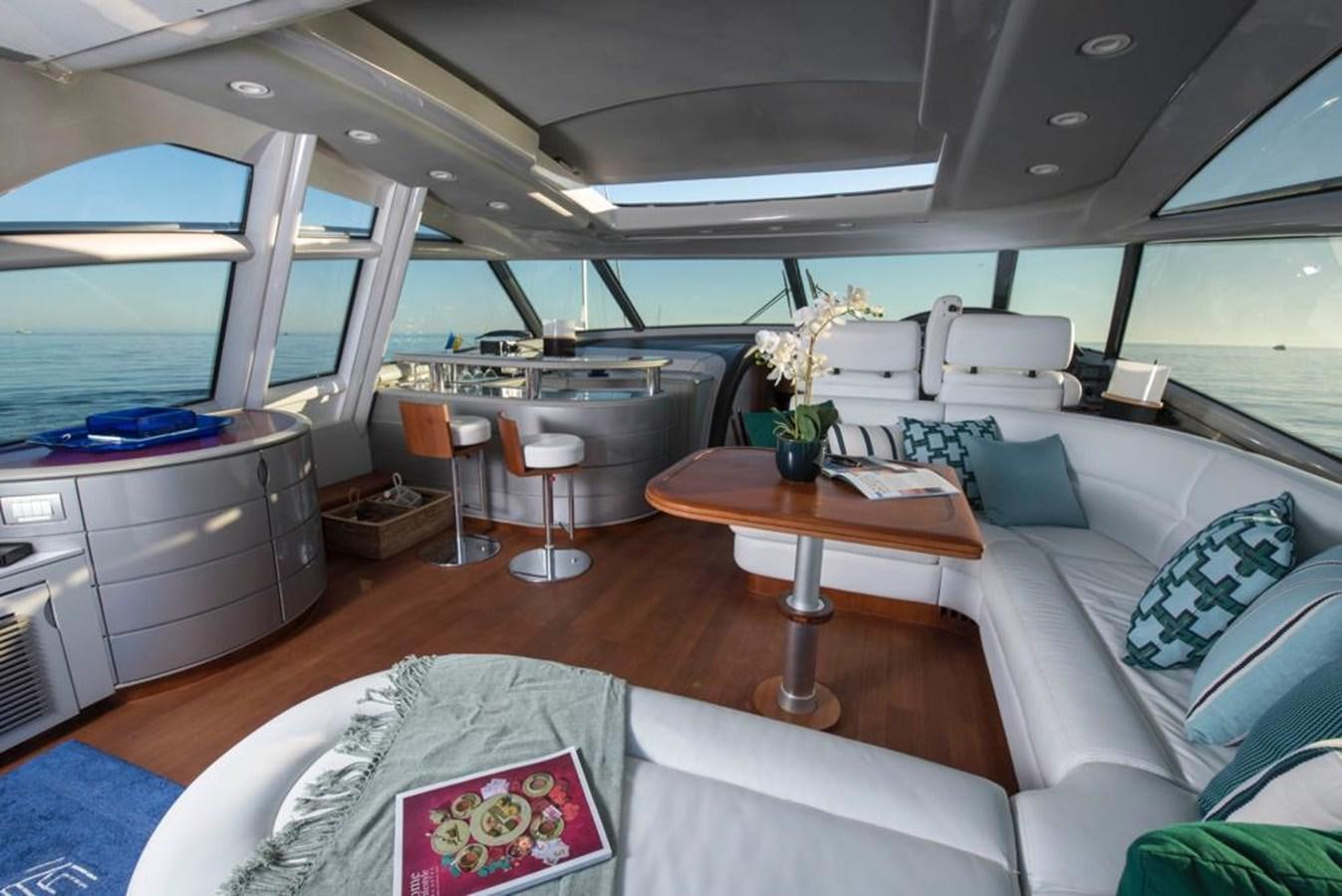 a living room with a couch and a coffee table aboard 4F Yacht for Sale
