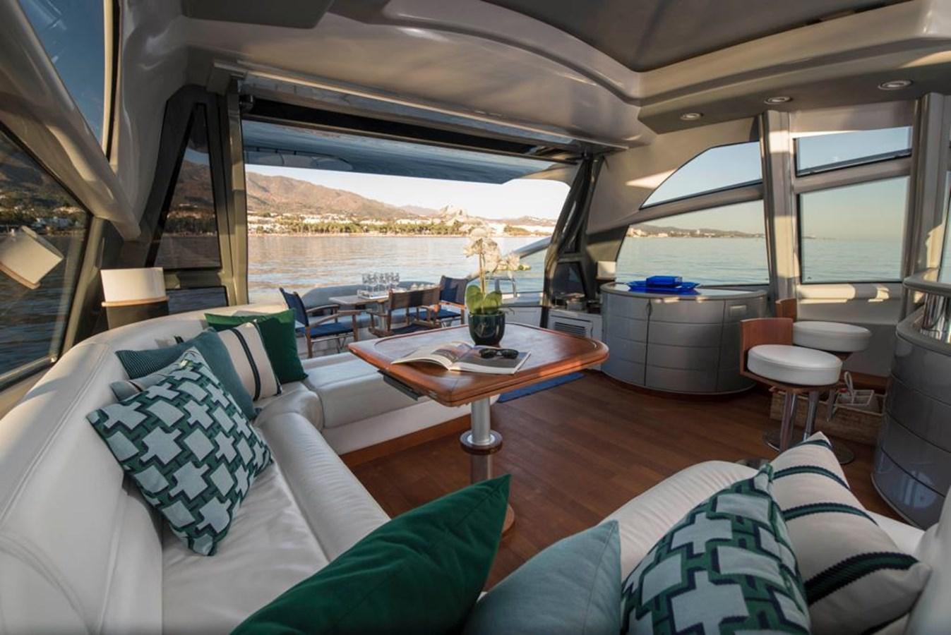 a room with a table and chairs aboard 4F Yacht for Sale