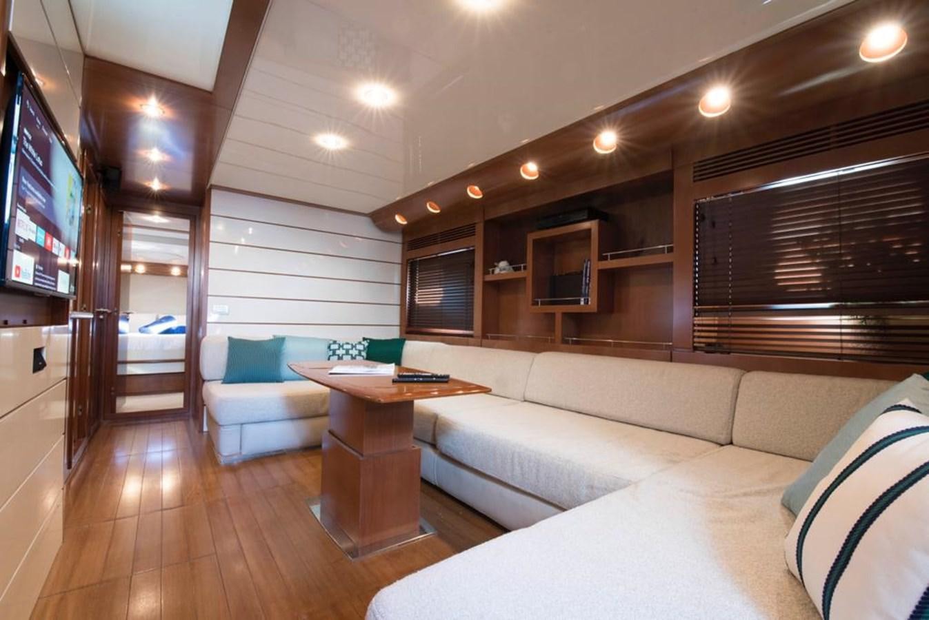 a living room with a wood floor aboard 4F Yacht for Sale