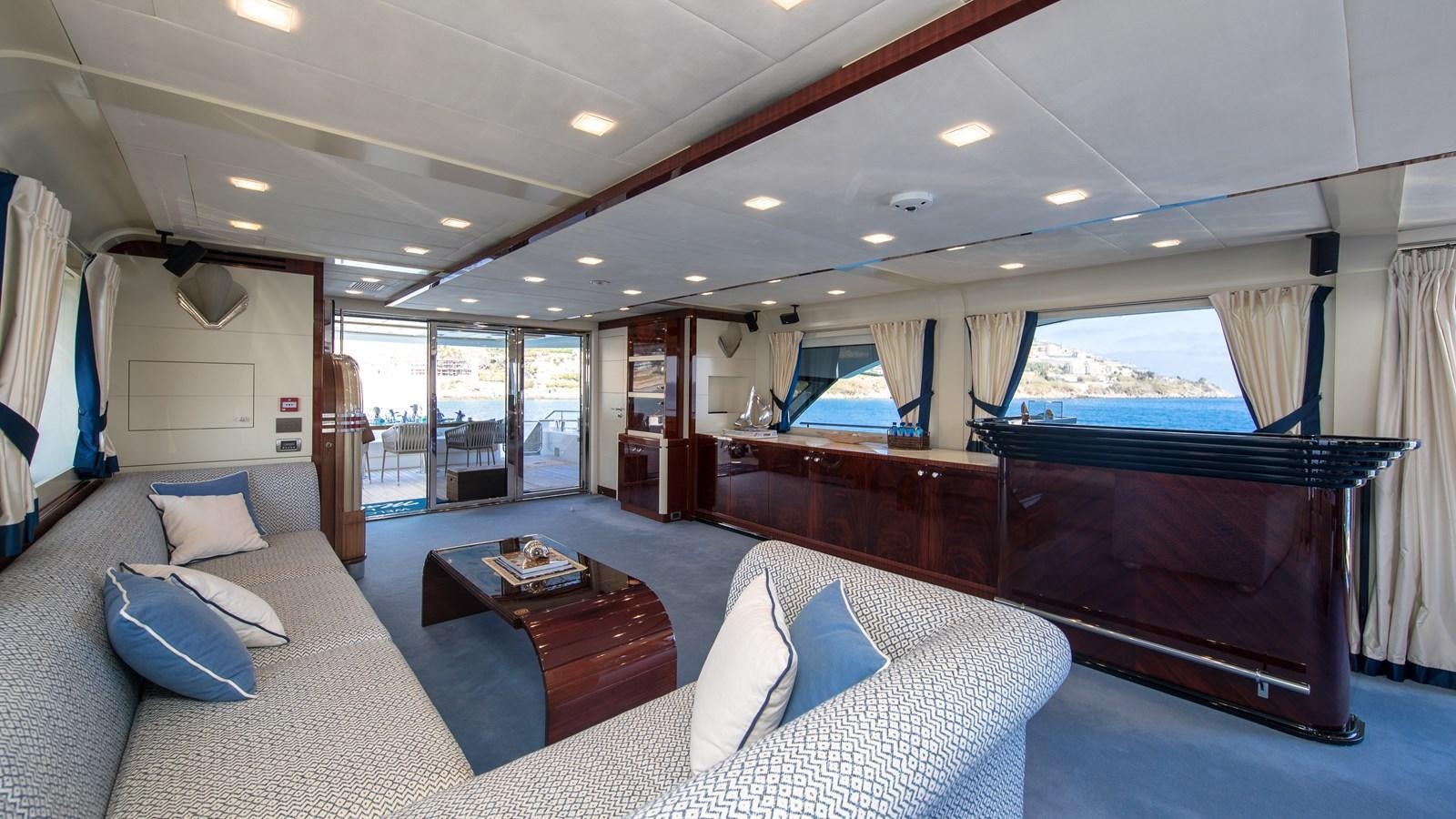 a large living room with a large bed and a large window aboard MARENGO UNO Yacht for Sale