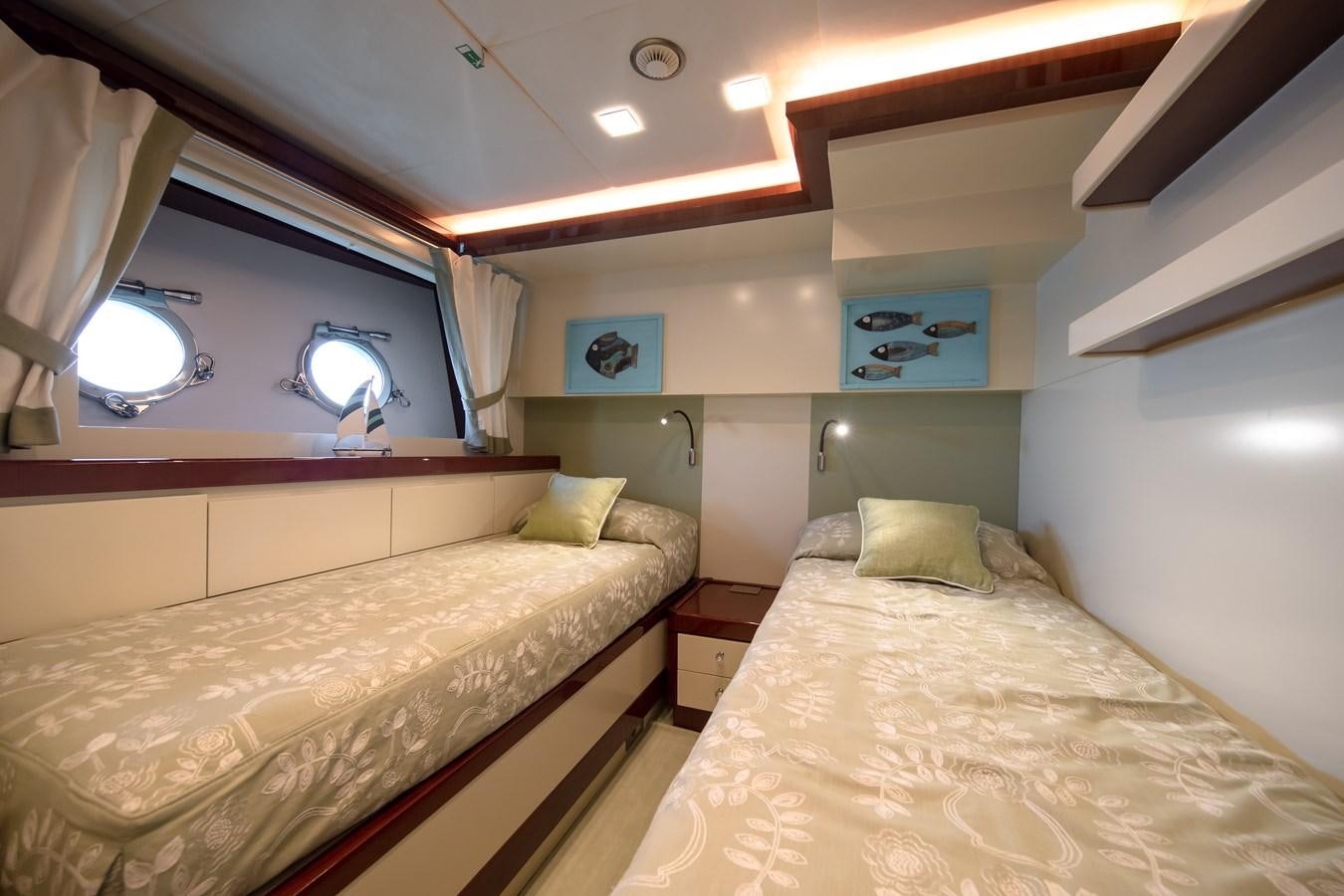a room with two beds aboard MARENGO UNO Yacht for Sale